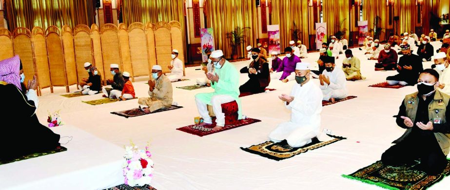 President Md. Abdul Hamid offers munajat after the completion of Eid-ul-Fitr prayer in the Durbar Hall of Bangabhaban on Friday. PID photo