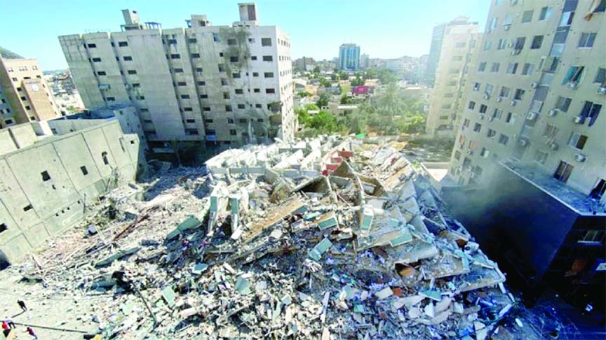 A tower housing AP, Al Jazeera offices collapses after Israeli missile strikes in Gaza city on Saturday.