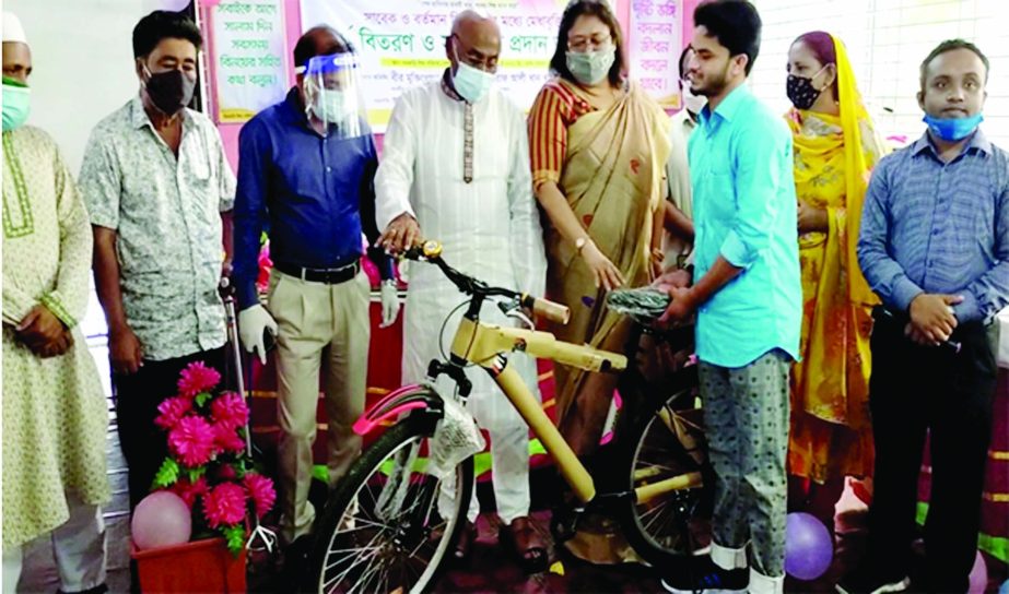 State Minister for social welfare Ashraf Ali Khan Khasru hands over bicycles to residents of Netrakona government orphanage family center on Wednesday. DC Netrakona Kazi Mohammad Abdur Rahman and social worker Kamrunnesa Ashraf Dina were present there.