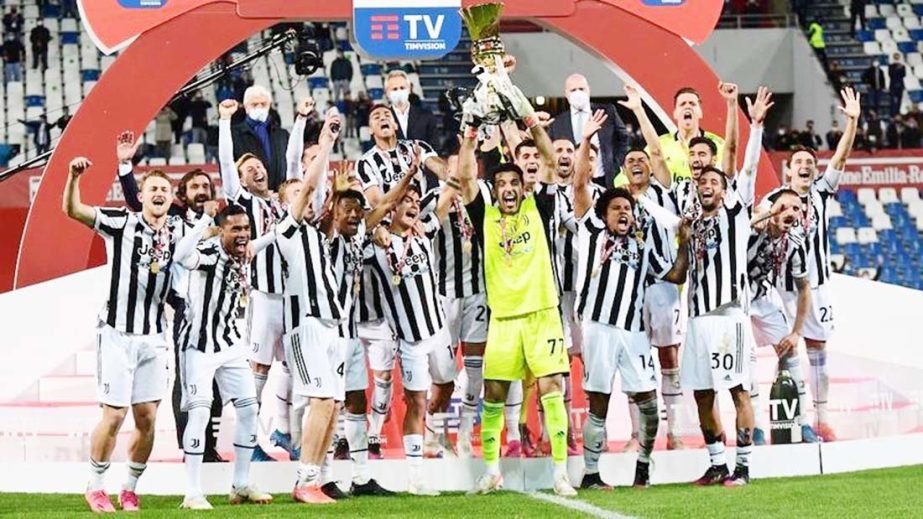 Juventus' goalkeeper Gianluigi Buffon holds the winner's trophy as Juventus players celebrate winning the final of the Italian Cup (Coppa Italia) football against Atalanta at the Citta del Tricolore stadium in Reggio Emilia on Wednesday.