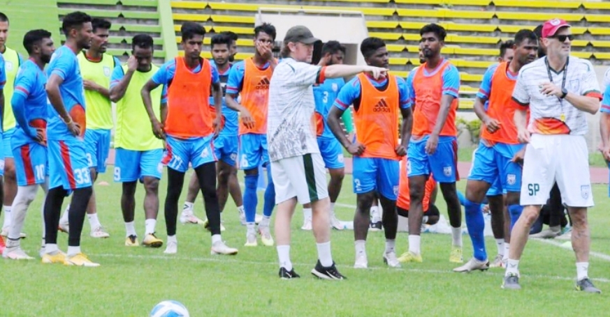 Head Coach of Bangladesh Football team Jamie Day (centre front) giving instructions to the booters of Bangladesh during their practice session at the Bangabandhu National Stadium on Friday.