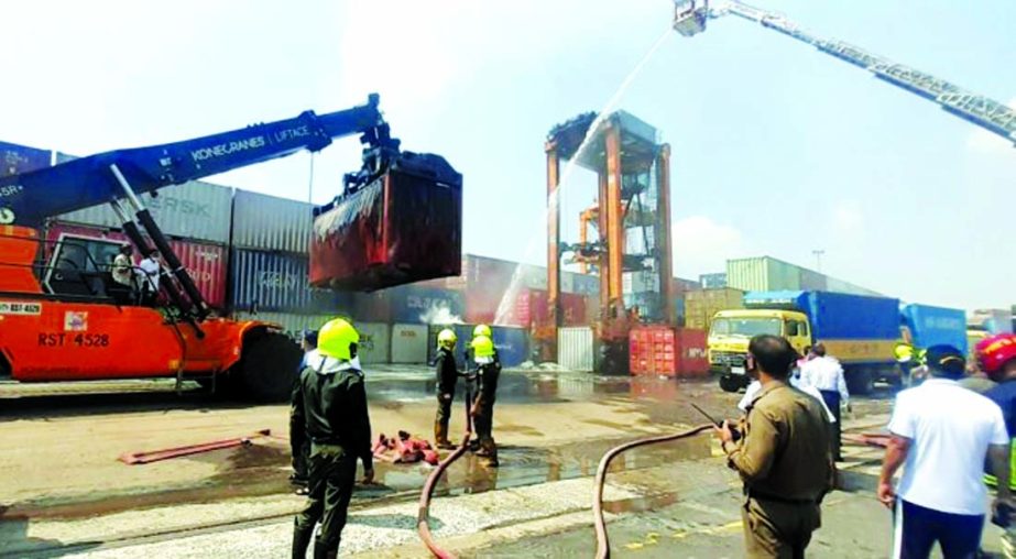 Firefighters douse blaze that broke out at a container in Chattogram port's yard number 8 on Saturday morning. Photo: Collected