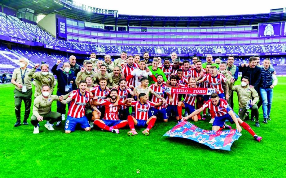 Atletico Madrid´s players celebrate after winning the Spanish league football match against Real Valladolid FC and the Liga Championship title at the Jose Zorilla stadium in Valladolid on Saturday.
