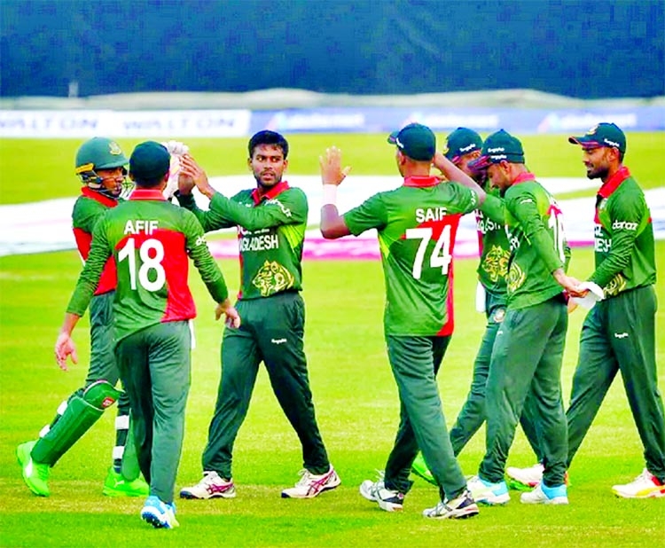 Mehidy Hasan Miraz (third from left) and Mushfiqur Rahim (extreme left) celebrate after dismissal of a Sri Lankan wicket during the first ODI match between Bangladesh and Sri Lanka at the Sher-e-Bangla National Cricket Stadium in the city's Mirpur on Sun