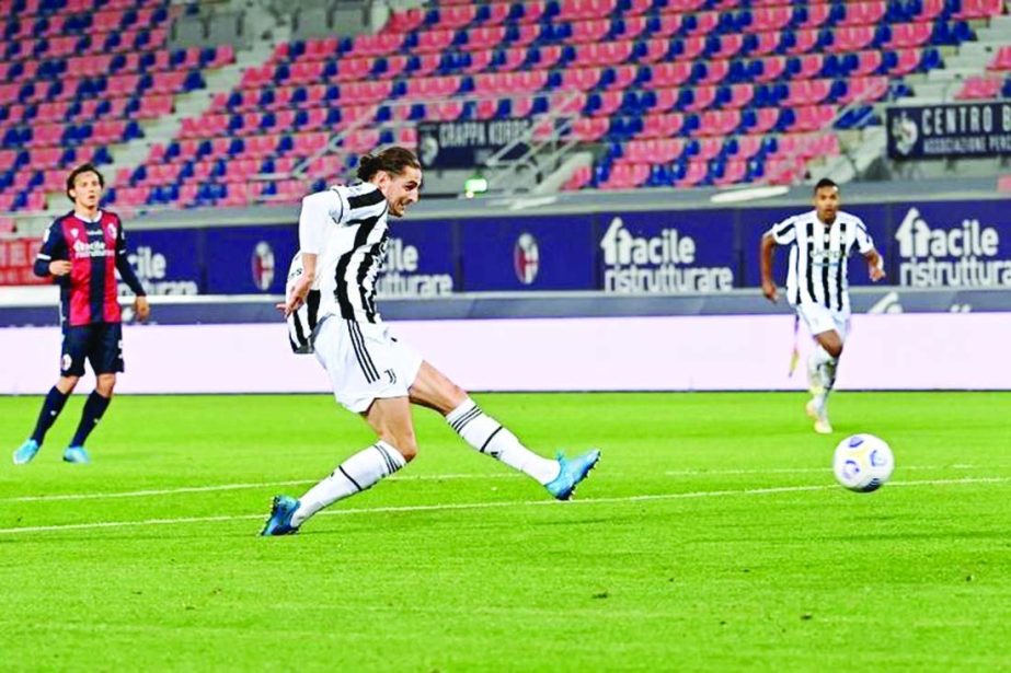 Juventus' midfielder Adrien Rabiot shoots to score the third goal during the Italian Serie A football match between Bologna and Juventus at the Renato-Dall'Ara stadium in Bologna on Sunday.