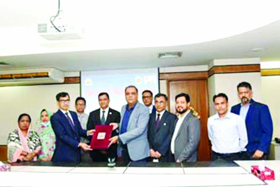 Mahmudul Hossain Khan, Member (Investment Promotion) of the Bangladesh Export Processing Zones Authority (BEPZA) and Pravin Satyapal Uppal, Chairman of Khyaati Leather, exchanging documents after signing an agreement at BEPZA Complex in Dhaka recently.