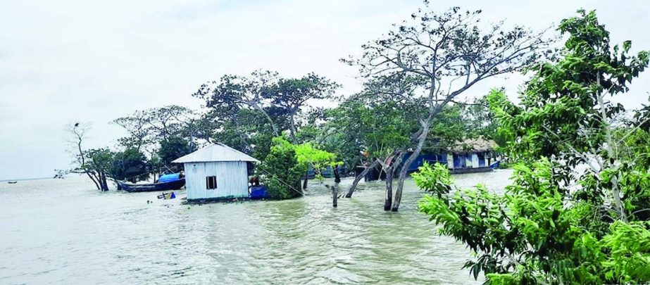 A village in Bhola's Charfesson upazila inundates on Tuesday after rivers swelled due to high tide amid cyclone Yaas.