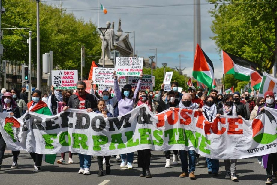 Pro-Palestinian protesters seen on O'Connell Street, Dublin, during a Rally for Palestine in Dublin, Ireland.