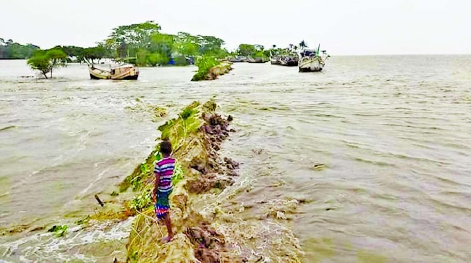 Embankment breched and low-lying areas of the coast submerged by flood water under impact of cyclone 'Yaas'. This photo shows that several villages at Rangabali in Patuakhali district inundated after an embankment collapsed on Wednesday.