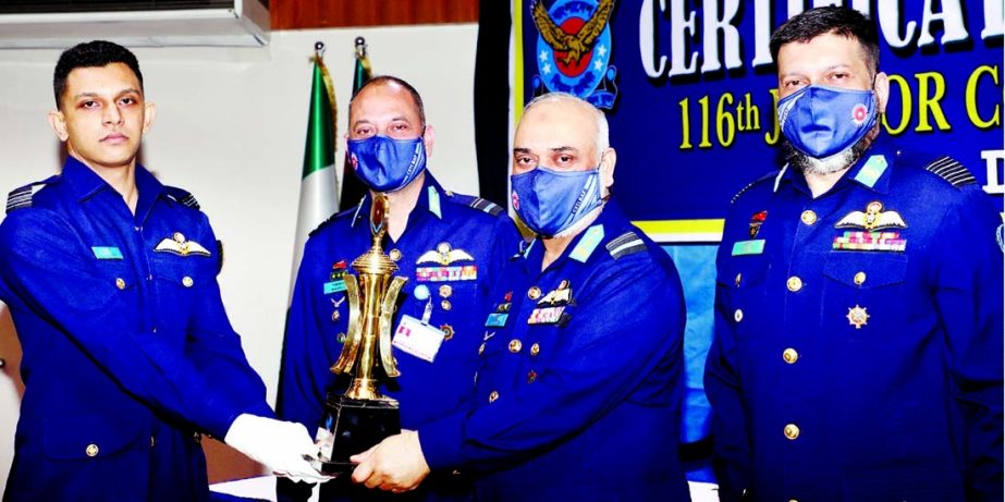 Assistant Air Force Chief (Planning) Air Vice Marshal M Shafiqul Alam hands over Chief of Air Staff's Trophy to Squadron Leader Dhrubo Sarkar for his best performance in the 116th Junior Command and Staff Course at a ceremony held at Falcon Hall in the