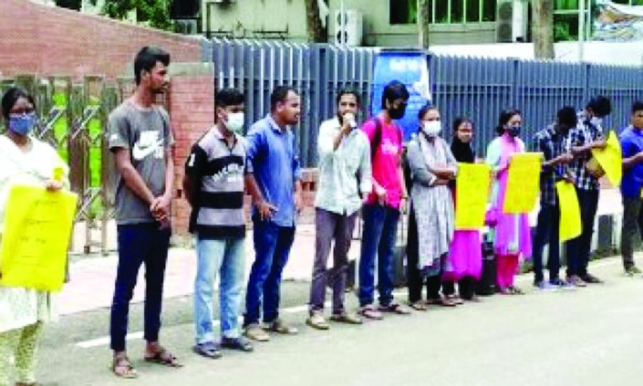 Students in Sylhet form human chain to press their demand of opening the educational institutions held at the City's central Shahid Minar on Thursday.