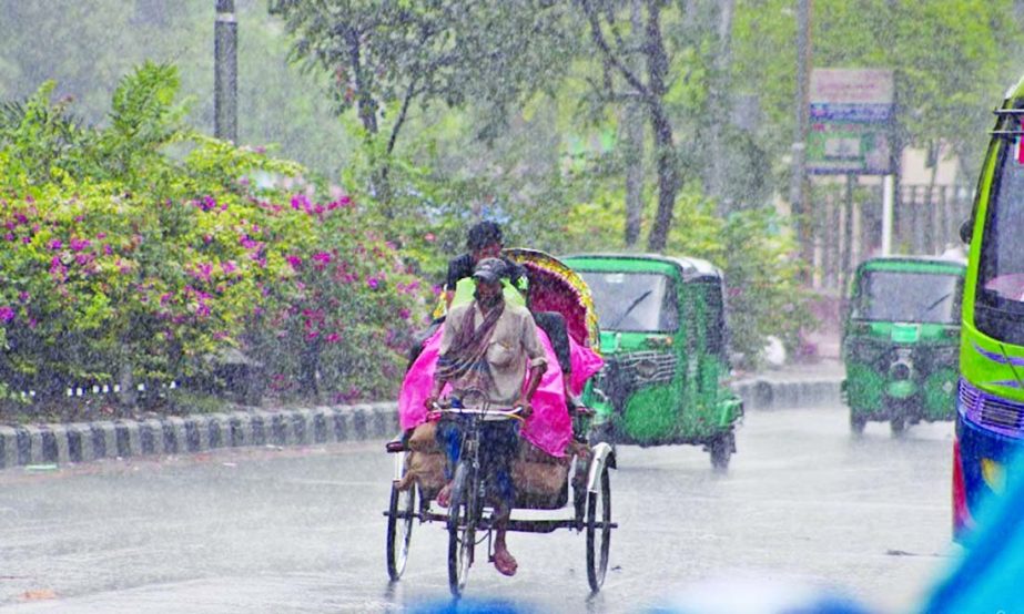 A rickshaw puller carries a passenger being with a polythene as there was a small speall of rainfall in the capital on Friday.