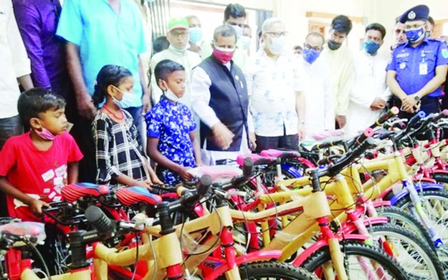 State Minister for Civil Aviation and Tourism Advocate Mahbub Ali, MP distributes special education grants among the ethnic group students of Madhabpur Upazila under Habiganj district at an event held at Upazila Parishad auditorium on Friday.