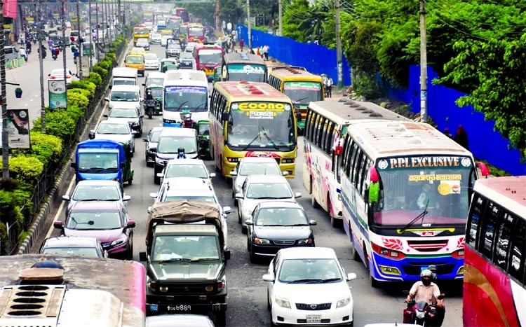 Vehicles get clogged in front of Banani Chairmanbari area in the capital on Monday.