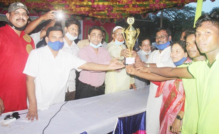 Upazila Chairman of Kaharole upazila valiant freedom fighter Md Abdul Malek Sarkar handing over the champions trophy to No.2 Rasulpur Union XI, which emerged the champions in the Father of the Nation Bangabandhu Sheikh Mujibur Rahman Gold Cup Footb