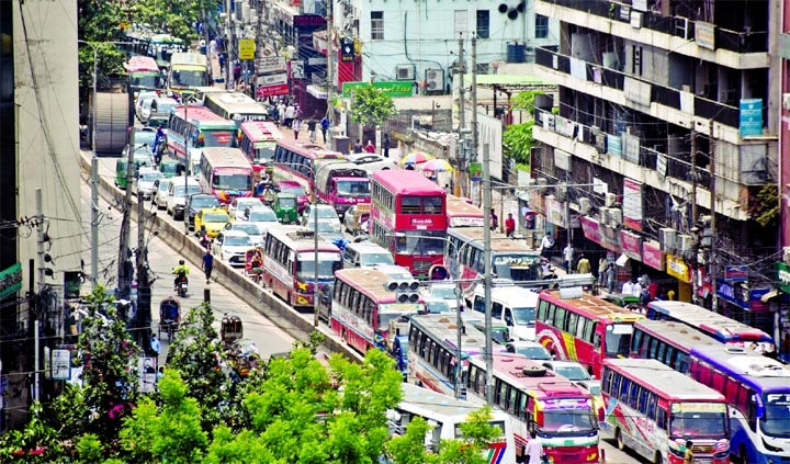 Motor vehicles get clogged at Paltan area in the capital on Wednesday there was a grid lock amid lockdown.