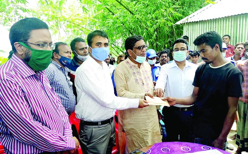 Deputy Commissioner of Rangpur, Md Rezaul Karim hands over cheques as financial help to the family members of the children died after drowning in Bhurungamari Kurigram, Rangpur Division on Wednesday.