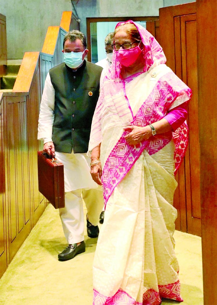 Prime Minister Sheikh Hasina and Finance Minister AHM Mustafa Kamal enter the parliament chamber to present the budget for the 2021-22 fiscal year on Thursday.