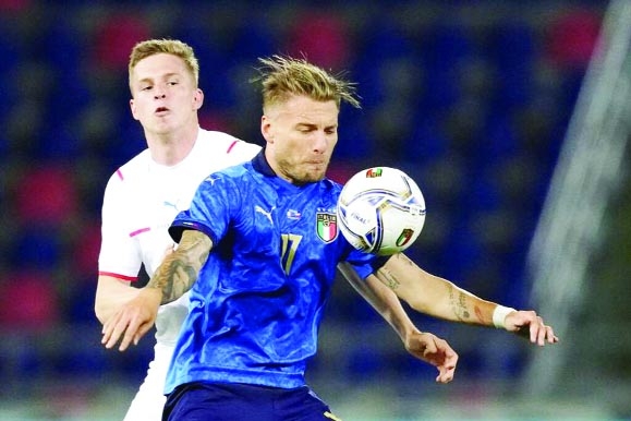Italy's Ciro Immobile(right) is challenged by Czech Republic's David Zima during the international friendly soccer match between Italy and the Czech Republic in Bologna, Italy on Friday.