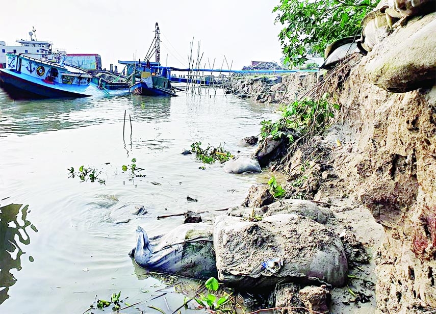 A large portion of Rajbari-Doulatdia Ferry Ghat has devoured in the river water resulting in disruption of communication. This photo was taken on Saturday.