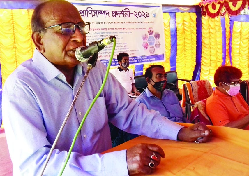 Former State Minister Prof Abdul Kuddus addresses a Livestock Demonstration Fair as chief guest in Baraigram on Saturday.