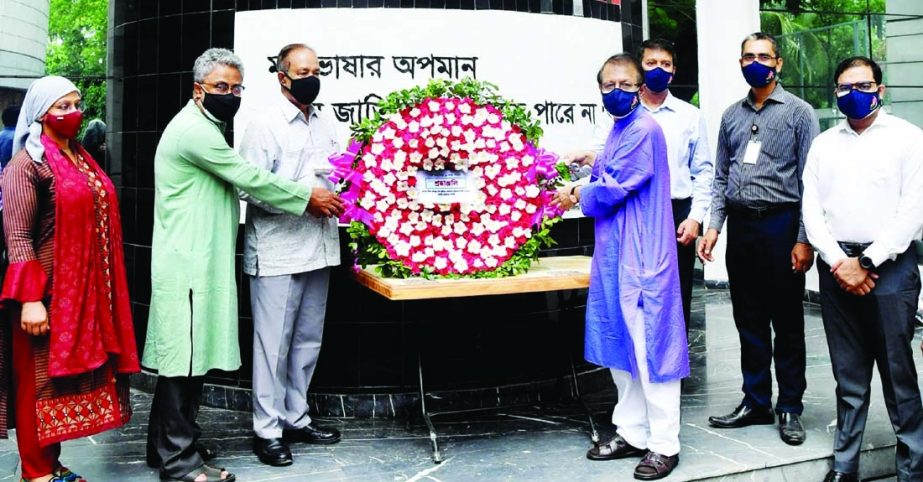 Chief Coordinator of Bangabandhu's Birth Centenary Implementation Committee Dr. Kamal Abdul Naser Chowdhury, among others, pays floral tributes at the mural of Bangabandhu at International Mother Language Institute in the city on Monday marking Historic