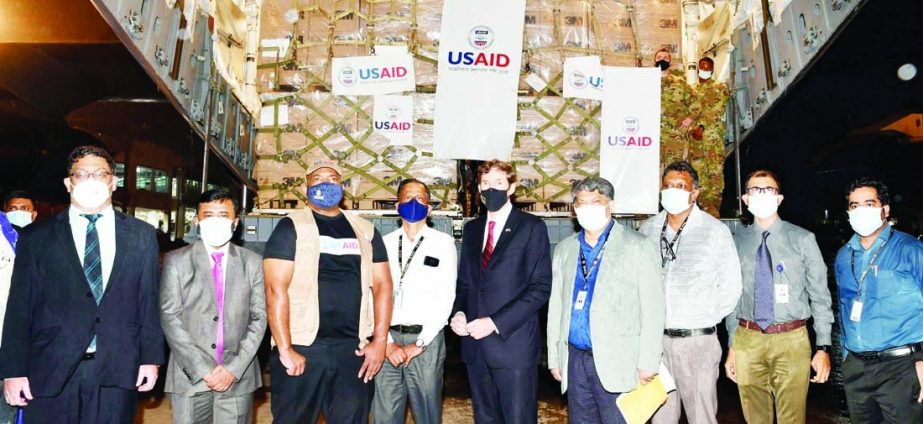 US Envoy to Bangladesh Earl R. Miller hands over medical equipment of Covid-19 arrived from US to Line Director of Health Department Prof Rubed Amin at Hazrat Shahjalal International Airport on Monday.