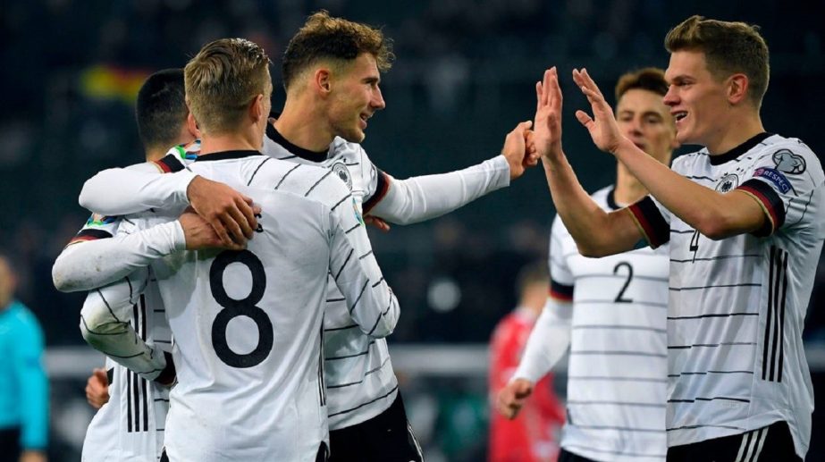 Germany players celebrate one of their seven goals against Latvia in their warm-up friendly football match on Monday.