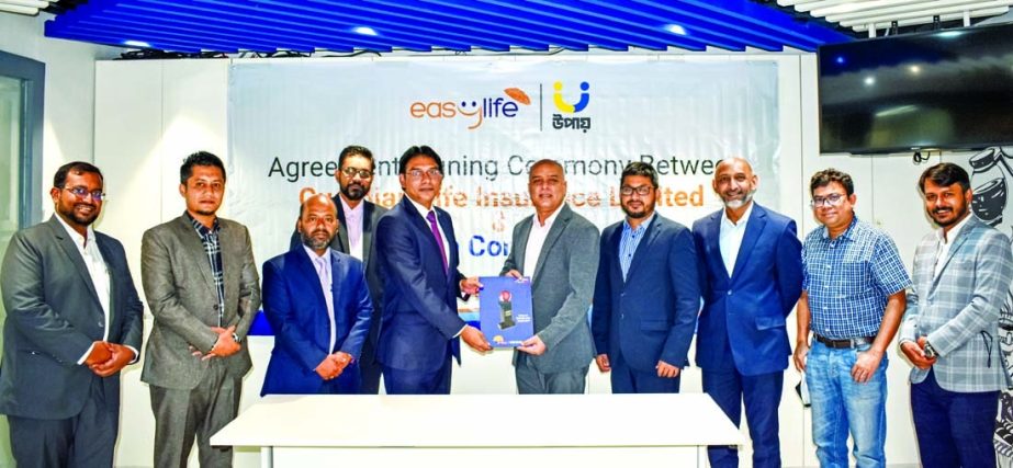 Sydul Haque Khandaker, Managing Director and CEO of upay (a subsidiary of the United Commercial Bank) and Sheikh Rakibul Karim, DMD of Guardian Life Insurance (GLI), exchanging document after signing an agreement at GLI head office in the capital recently