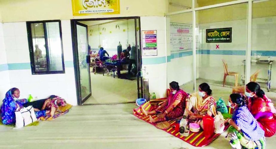 Family members are seen waiting at the yellow zone of Khulna dedicated corona hospital for their near and dear ones who are undergoing treatment for Covid-19. This photo was taken on Wednesday.