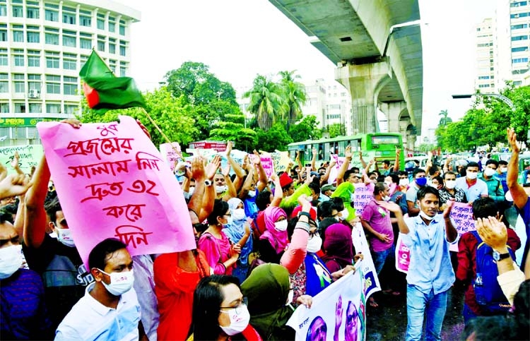 Demonstrators stage a sit-in programme at Shahbagh intersection in the capital on Friday demanding age-limit at 32 for government jobs during coronavirus surge.