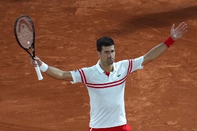 Serbia's Novak Djokovic celebrates after defeating Spain's Rafael Nadal during their semifinal match of the French Open tennis tournament at the Roland Garros stadium in Paris, France on Friday.