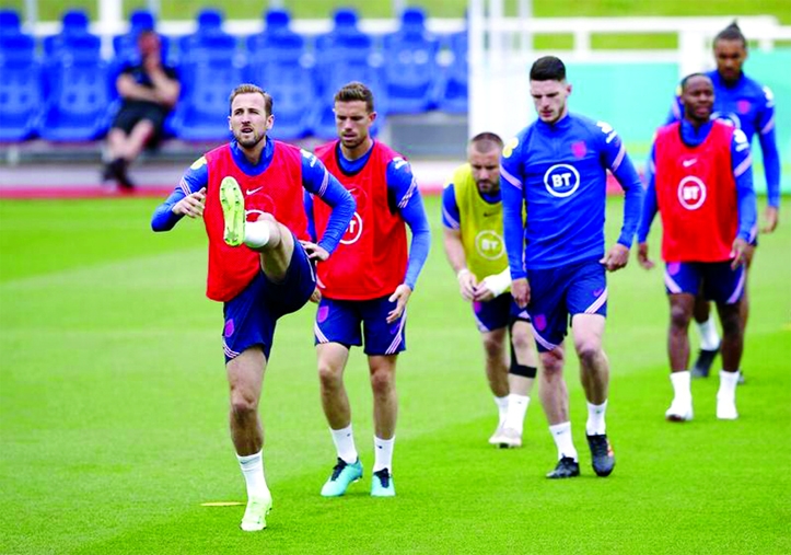 This photo captures England's Harry Kane (front) and teammates during a training session at St George's Park, Burton upon Trent, England on Friday.