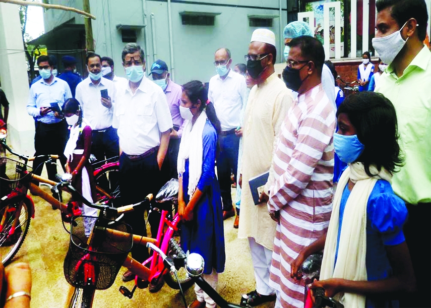 Senior Secretary, Department of Internal Resources and Chairman of National Board of Revenue, Dhaka Abu Hena Md. Rahmatul Munim as chief guest distributes bicycles among the students of Tarash at a formal ceremony held at the Upazila Parishad premises on