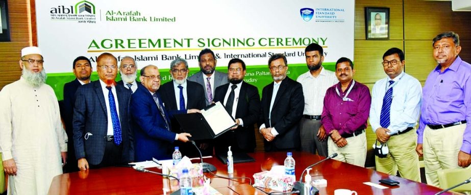 Md. Shafiqur Rahman, DMD of Al-Arafah Islami Bank Limited and HTM Quader Newaz, Treasurer (In Charge) of the International Standard University, exchanging a MoU signing document on behalf of their respective organizations on Wednesday. Under the deal, cus