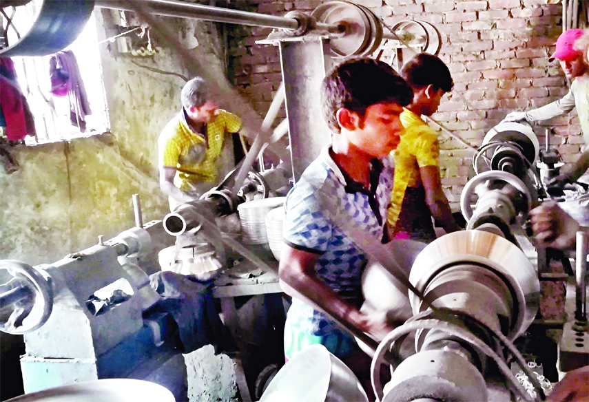 Children are seen working at a factory risking their lives at Kamalbagh (Kamrangirchor) area in the capital on Saturday despite ban of child labour.