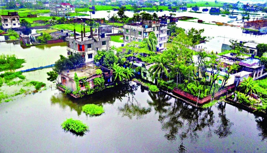 Continuous rain in the past few days has created waterlogging in the Dhaka-Narayanganj-Demra (DND) dam area. The aerial view of this photo shows that a large part of Matuail at Demra in the capital inundates due to inadequacies of the drainage system.