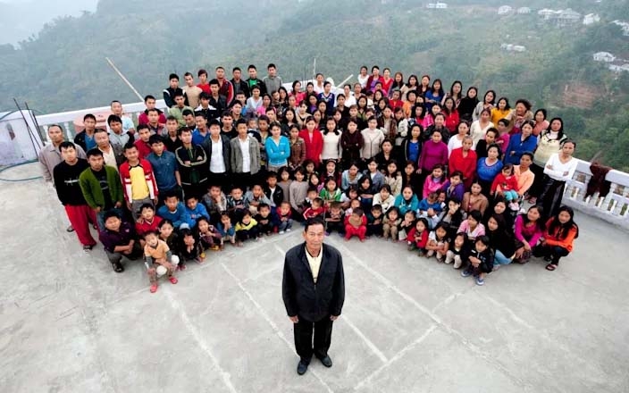 A family photograph of the Ziona family, with a total of 181 members. Ziona Chana, 67, is at the front - Barcroft Media