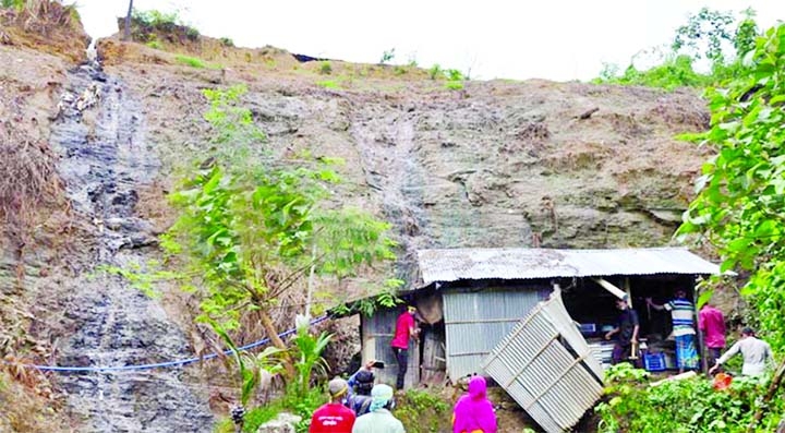 Chattogram district administration conducts an eviction drive against the people who live illegally at foothill risking death in landslides at Linkroad area of Baizid Fouzdarhat on Monday.