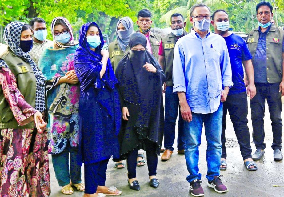 Businessman and Dhaka Boat Club member Nasir U Mahmood (jeans pants and sky blue shirt) at the police's Detective Branch office in Dhaka after his arrest along with four others at Uttara on Monday in a case filed by film actress Pori Moni on charges of a
