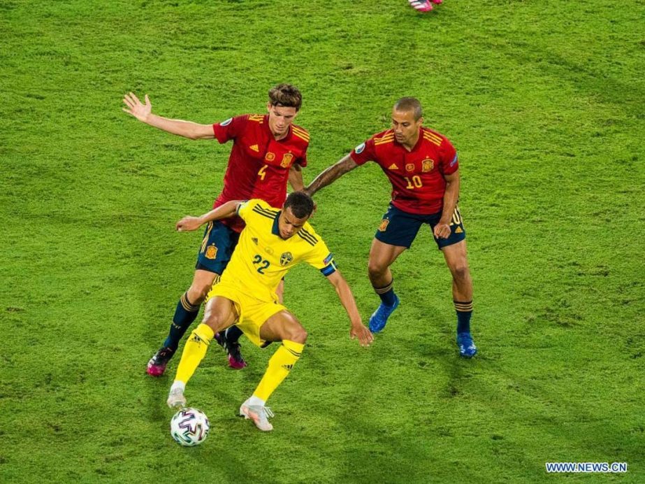 Pau Torres (top left) and Thiago Alcantara (top right) of Spain compete with Robin Quaison of Sweden during the UEFA Euro 2020 Championship Group E match in Seville, Spain on Monday.