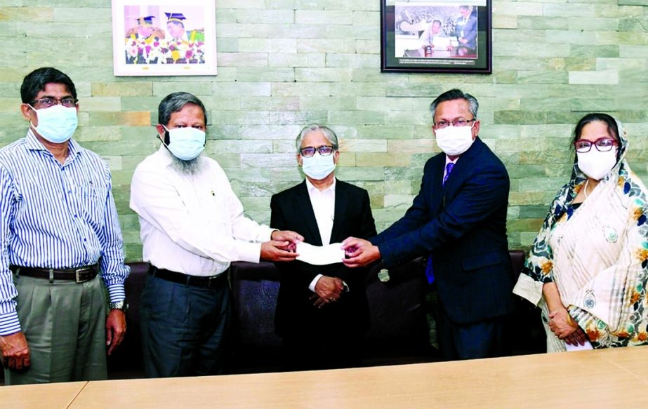 On behalf of Executive Director and Founder of Heal Bangladesh Foundation Trust Fund Prof Dr. Shaheen Islam her husband SM Bakhtiar Alam hands over a cheque of Tk 10 lakh to the Treasurer of Dhaka University Prof Momtaj Uddin Ahmed at the VC's office lo