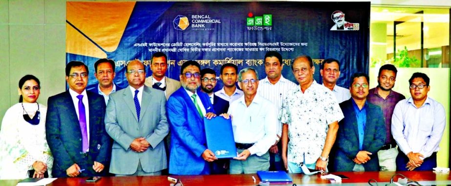 Tarik Morshed, Managing Director & CEO of Bengal Commercial Bank Limited and Dr. Md. Mafizur Rahman, Managing Director of SME Foundation, exchanging document after signing an agreement for facilitating fresh loan to the corona affected entrepreneurs from