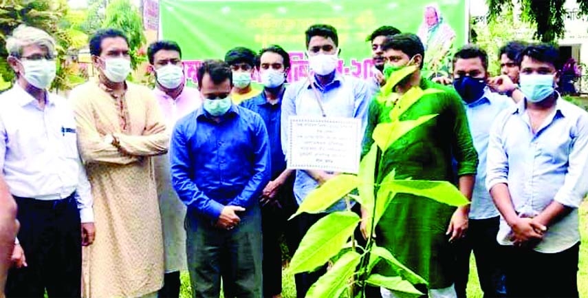 Manikganj Deputy Commissioner SM Ferdous inaugurates the one lakh tree planting program by planting red Kadam tree on the first day of Ashaorganized by Green Environment Movement, Manikganj district branch at District Muktijoddha Shishu Park on Tuesday.