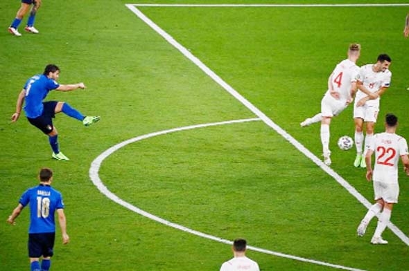 Italy's midfielder Manuel Locatelli (left) shoots to score the team's second goal during the UEFA EURO 2020 Group A football match between Italy and Switzerland at the Olympic Stadium in Rome on Wednesday.