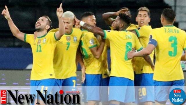 Brazil's Everton Ribeiro celebrates scoring their third goal with teammates.