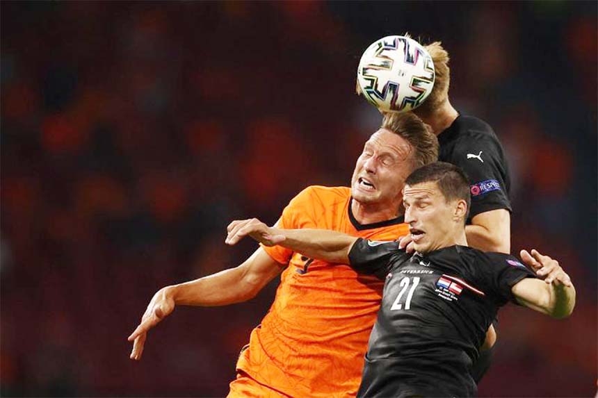 Netherlands' forward Luuk de Jong (left) heads the ball with Austria's defender Stefan Lainer during the UEFA EURO 2020 Group C football match between the Netherlands and Austria at the Johan Cruyff Arena in Amsterdam on Thursday.