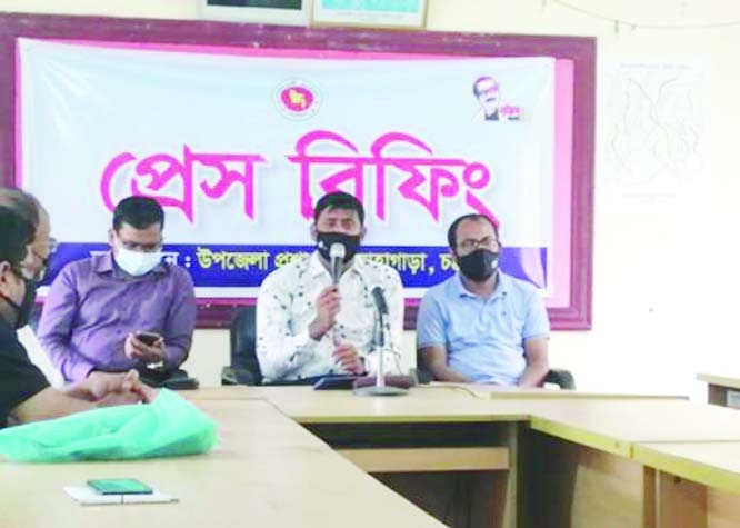 Lohagara Upazila Nirbahi Officer Ahsan Habib Jitu speaks at a press conference held at the Upazila Parishad meeting room on Thursday organized to brief the Prime Ministers' gift of giving houses to 170 families of the upazila.