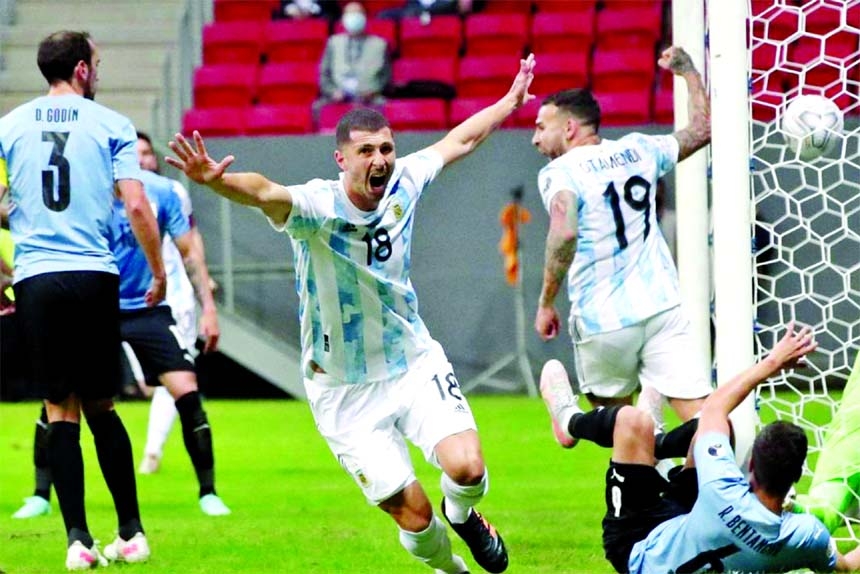Argentina's Guido Rodriguez celebrates after scoring his side's opening goal against Uruguay during a Copa America soccer match at the National Stadium in Brasilia, Brazil on Friday.