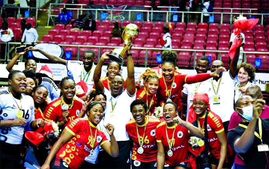 Team Angola celebrate with the trophy after the final match between Cameroon and Angola at the African Women's Handball Championships in Yaounde, Cameroon on Friday.
